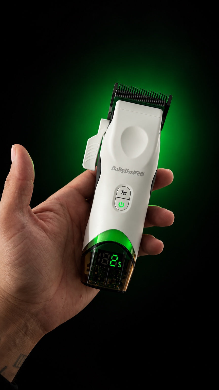 BaBylissPRO x Tomb45 white wireless charging clipper in hand, close-up